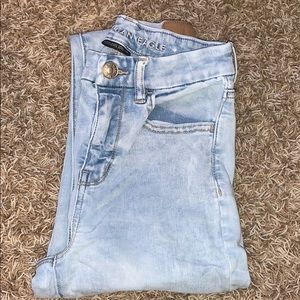 Light blue ripped jeans